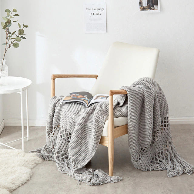 grey knitted  throw blanket